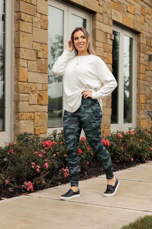 Are you looking for the perfect leggings? Look no further than the all-new Camo 2.0 leggings! These high-waisted leggings are incredibly soft and sure to keep you comfortable all day long. Plus, they have pockets! These leggings are made of 92% polyester and 8% spandex blend, giving them the perfect amount of stretch and durability. Make a bold statement and take your look to the next level with the new Camo 2.0 leggings!Sizing OS (One Size) - Sizes 4-10TC (Tall & Curvy) - Sizes 12-18TC2 (Tall & Curvy+) Sizes 20-28InseamOS - 70 cm (approx 27.95")TC - 72 cm (approx 28.35")TC2 - 74cm (approx 29.12") Size Measurement (cm): OS: 34.5 (Waist), 42.5 (Hips), 70.0 (Inseam), 94.0 (Length) TC: 39.0 (Waist), 53.0 (Hips), 74.0 (Inseam), 98.0 (Length) TC2: 44.0 (Waist), 56.0 (Hips), 72.0 (Inseam), 101.0 Camo Tights Outfit, Fall Athleisure Yoga Pants For Everyday, Fall Athleisure Leggings With Pockets, Everyday Fall Athleisure Leggings, Workout Leggings With Pockets For Fall, Fall Workout Leggings With Pockets, Sporty Leggings With Pockets For Fall, Stretch Activewear With Side Pockets For Fall, Sporty Fall Leggings With Pockets