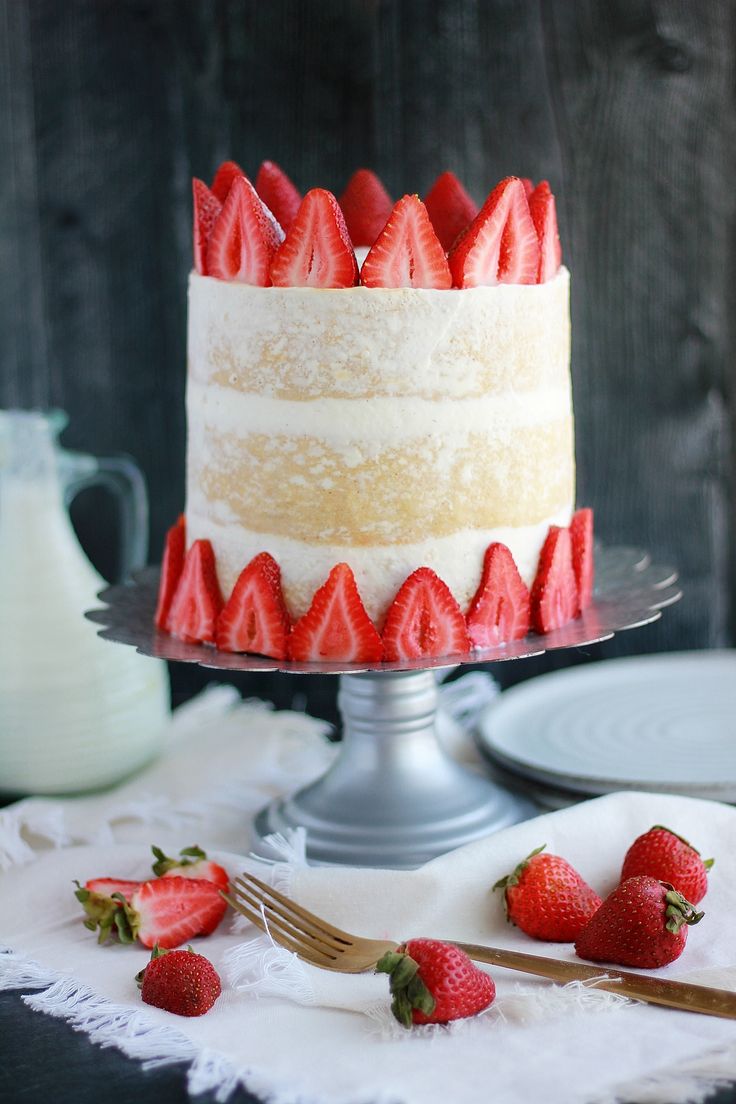 there is a cake with strawberries on the plate