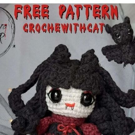 a crocheted doll with black hair and big eyes