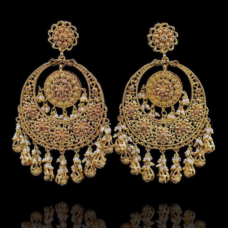 Embrace elegance: Inspired by Deepika Padukone's Wedding Bliss, our exquisite earrings radiate timeless beauty! Modern and stylish dangle earrings with gold matte finish and cut-work details, perfect for festive wear. Approximate earrings length is 3.25". Gold-plated on high-quality brass as base metal. Made by order. Kindly allow 5-7 weeks for the delivery of this item. For custom or urgent requests, please contact support@alacouture.com. *Please Note: We use faux stones and beads in all of our Luxury Gold Bohemian Chandelier Earrings, Ornate Kundan Gold Earrings, Ornate Gold Brass Chandelier Earrings, Gold-tone Brass Chandelier Earrings, Ornate Yellow Gold Brass Earrings, Faux Stone, Cut Work, Fashion Story, Base Metal