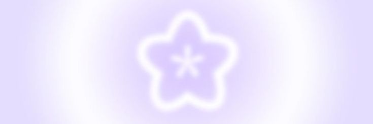 a blurry image of a white flower on a purple background