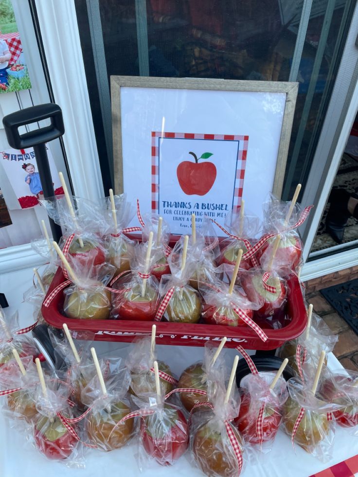 apples are wrapped in cellophane and ready to be eaten at an apple picking event