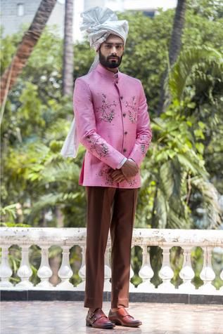 Pink raw silk bandhgala with floral embroidered motifs and band collar.
Components:1
Embroidery
Neckline:Band
Sleeve Length:Full
Fabric:Raw silk
Color:Pink
Side slits
Closure: Button front
Note: Pants worn by the model are not for sale - Aza Fashions Embroidered Bandhgala, Bandhgala For Men, Formals For Men, African Dresses Men, Indian Heritage, African Dresses, Indian Ethnic Wear, Indian Design, Embroidered Silk