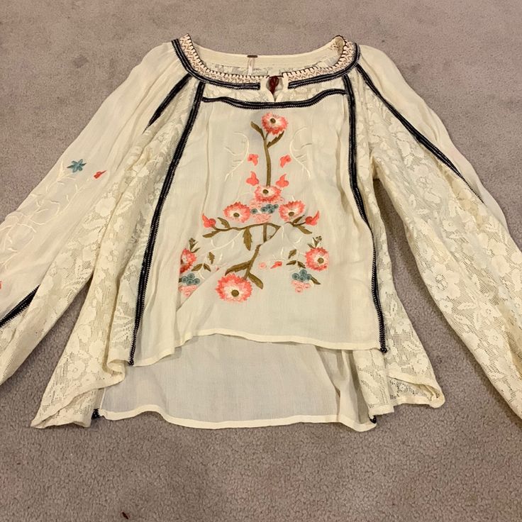 Beautiful Free People Lace Embroidered Top. Very Boho. New Without Tags. Size Small Spring Bohemian Embroidered Top With Floral Details, Bohemian Floral Embroidered Top For Spring, Bohemian Embroidered Top With Floral Design For Spring, Casual Embroidered Top With Intricate Embroidery For Spring, Bohemian Spring Embroidered Top With Intricate Details, Spring Bohemian Top With Intricate Embroidery, Spring Cream Top With Embroidered Hem, Cream Embroidered Spring Tops, Casual Embroidered Cream Blouse