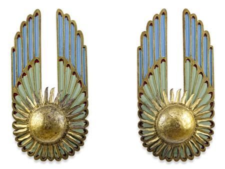 two gold and blue art deco wall sconces, one in the shape of an angel's wing