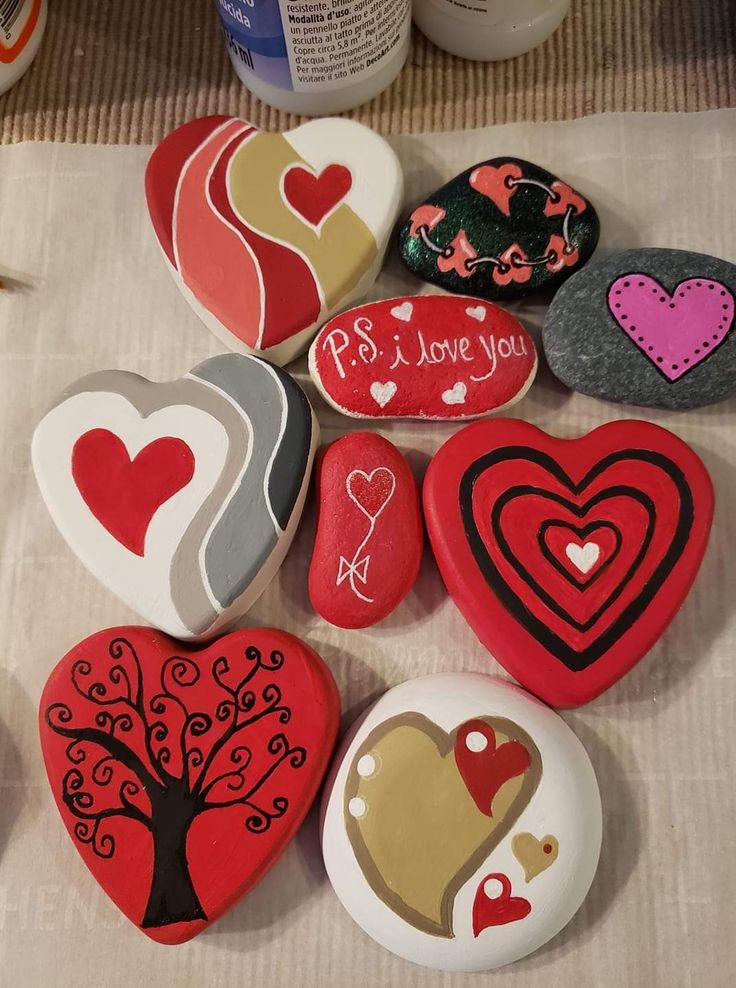 several painted rocks sitting on top of a table