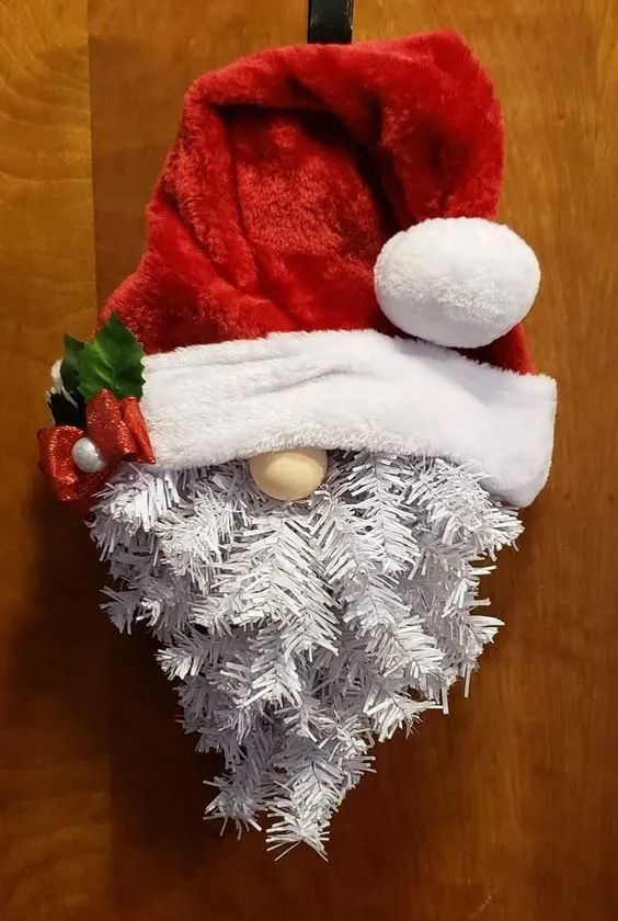 a santa claus hat hanging on the wall