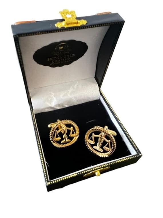 A stunning set of Legal Scales of Justice Cufflinks lavished in 24k Gold LAW GOLD  CUFFLINK SET - The detail is stunning! We are so proud to offer these - each painstakingly finished in multiple layers of pure gold. Very high quality set of cufflinks -  - A very nice weight, super detail and crafted to last indefinitely. Includes detailed hand signed and dated certificate pertaining to the gold plating. The certificate is housed in its own envelope.  Presented in a beautiful, luxurious double gi Gold Jewelry With Gift Box For Anniversary, Gold Jewelry With Gift Box, Collectible Gold Clip-on Jewelry, Luxury Gold Cufflinks For Gift, Business Gold Clip-on Jewelry, Luxury Gold Round Cufflinks, Gold Clip-on Jewelry For Business, Gold Hallmarked Cufflinks For Business, Hallmarked Yellow Gold Cufflinks For Anniversary