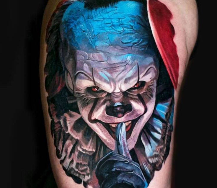 the evil clown is depicted on this man's arm