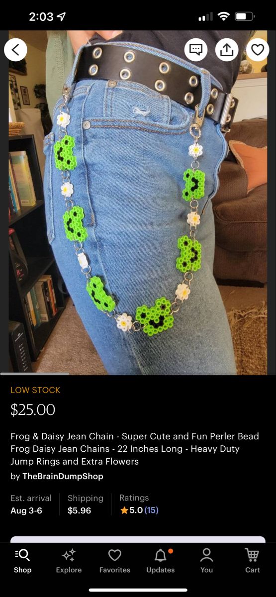 the jeans are decorated with green beads and flowers