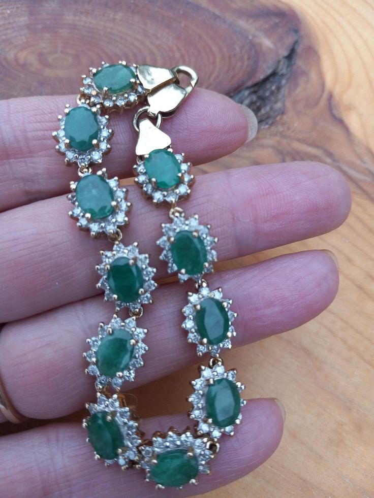 Absolutely Stunning 14k Gold, Diamond Emerald Flower design Bracelet .. Natural  Columbian Emerald in beautiful  bright green  color. WOW  Look Spectacular,  perfect Vintage Pre Owned Condition.  All sales are final,  no return.  Weight is 21.10 Grams on my scale.  Some Pics ENLARGED to see details. ATTENTION BUYERS ALL ITEMS FROM MY SHOP MUST BE PURCHASED STRAIGHT THRU ETSY.COM WEBSITE ONLY,  NOT THRU OFFSITE ADDS GOOGLE AND OTHERS  All orders purchasing from Google and others will be cancelled Luxury Green Oval Bracelet, Green Oval Jewelry For Party, Green Emerald Bracelets For Party, Green Oval Jeweled Jewelry, Green Round Bracelets For Party, Green Emerald Bracelets For Formal Occasions, Green Emerald Bracelets For Formal Events, Green Gemstone Bracelet For Weddings, Formal Green Emerald Bracelets