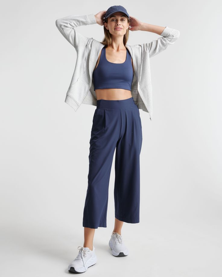 These look like classic work pants, but move like your favorite activewear. Our cropped Performance Tech Wide Leg Commuter Pants have just the right amount of stretch for days when you’re on the go, plus the sun protection and quick-dry properties of top-notch performance wear. And they look great with sneakers.  | Quince | Women's Performance Tech Wide Leg Pants in Navy, Size XS, Recycled Polyester Wide-leg Yoga Pants With 4-way Stretch, Wide-leg 4-way Stretch Yoga Pants, 4-way Stretch Wide-leg Yoga Pants, Workout Yoga Pants With Pockets And 4-way Stretch, Spring Yoga Pants With 4-way Stretch, 4-way Stretch Yoga Pants For Spring, 4-way Stretch Yoga Pants With Pockets For Workout, Stretch Wide-leg Athleisure Joggers, Casual Moisture-wicking Capris For Workout