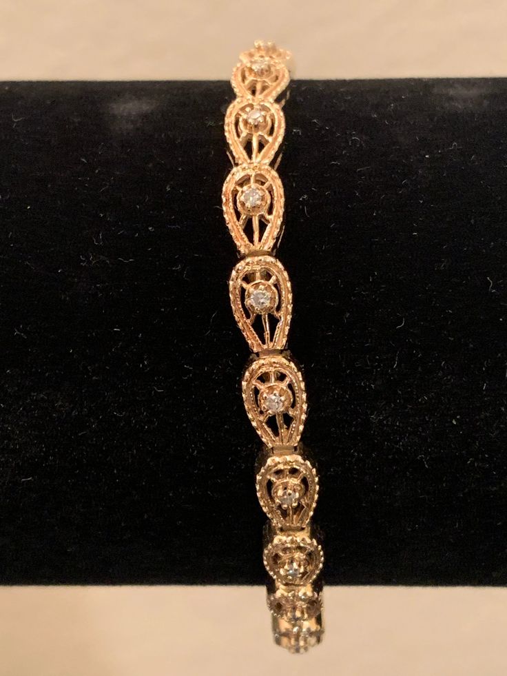 "Vintage Bracelet. Alas! 1+9=10=>1+0=1! w/ 19 round 0.05ct DMDs, 0.95ct total, solid 14K YG 14.3g (0.50oz) TM \"Circle K\", 18cm (7\"), 5mm. The bracelet came with the original 14K caratage mark and the trademark \"Circle K\" inscription. Applied the KEE Gold Tester device and it tested positive for solid 14K Gold. Applied the Diamond Selector II device and it tested positive for Diamond. Applied the Presidium Duo Tester II device to the gemstones and it tested positive for Diamond. The math is 14k Gold Bracelet With Diamond Accents, 14k Gold Round Diamond Bracelet For Anniversary, Formal 14k Gold Round Diamond Bracelet, Anniversary Yellow Gold Diamond Bracelet, Elegant Round Gold Bracelet Stamped 14k, 14k Gold Bracelet With Prong Setting, Gold Diamond Bracelet With Brilliant Cut In Oval Shape, Gold Bracelet With Diamond Accents For Anniversary, Gold Oval Diamond Bracelet With Brilliant Cut