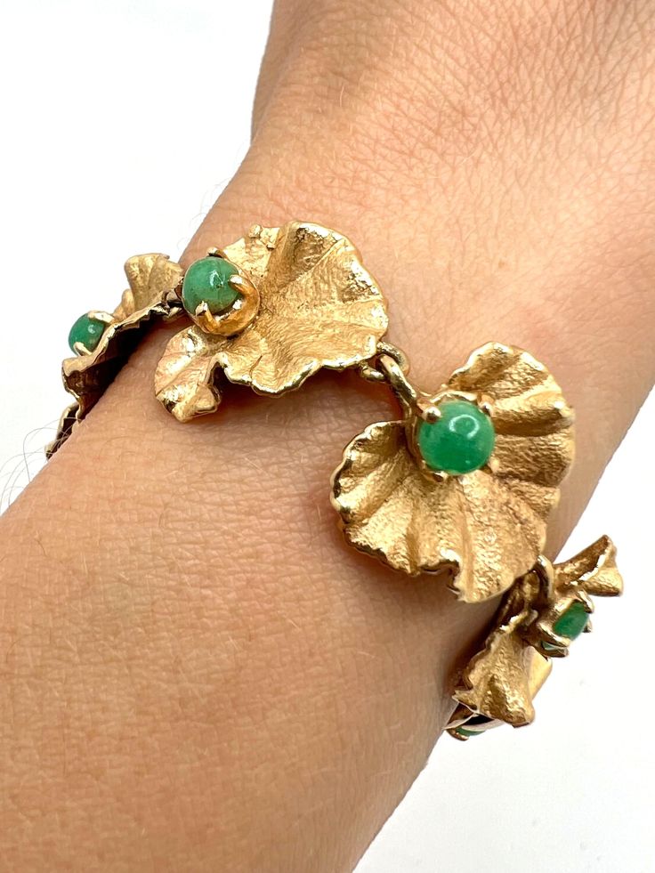 Gorgeous 14K Yellow Gold Emerald Floral Leaves Art Deco Bracelet Size 6.5 A perfect gift for your loved one for any special occasion or holiday!  Total Bracelet Weight: 21.52g Bracelet Length: 6.5 inches  Bracelet Width: 16.36mm Gemstone: Emerald  Item will be placed in a gift box. * Luxury Green Gold Bracelet As A Gift, Handmade Fine Jewelry Gold Bracelets, Luxury Green Gold Bracelet For Anniversary, Handmade Elegant 14k Gold Bracelets, Elegant Handmade 14k Gold Bracelets, Handmade Luxury Gold Bracelet As Gift, Handmade Luxury Gold Bracelet For Gifts, Luxury Handmade Gold Bracelet Gift, Luxury Handmade Gold Bracelet For Gift