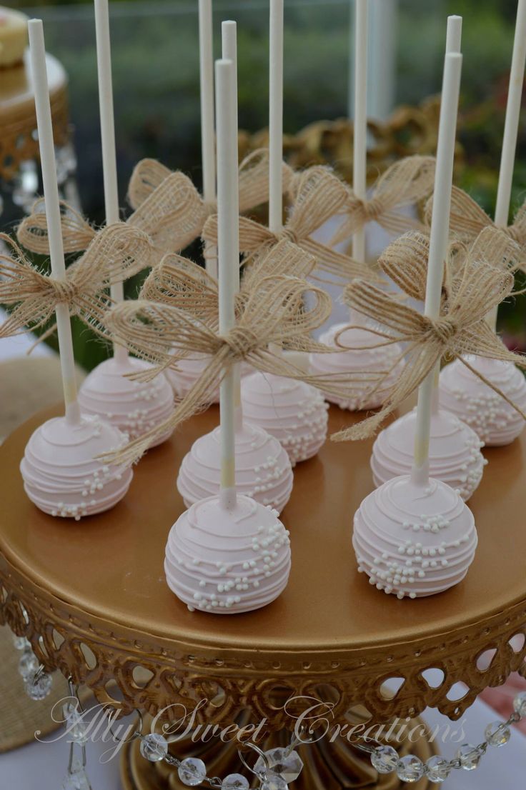 there are many desserts on the table with candles in them and tied to each other