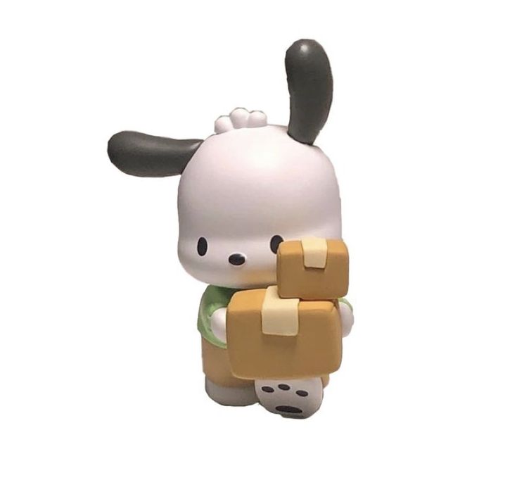 a small toy with a dog on it's back holding a piece of bread