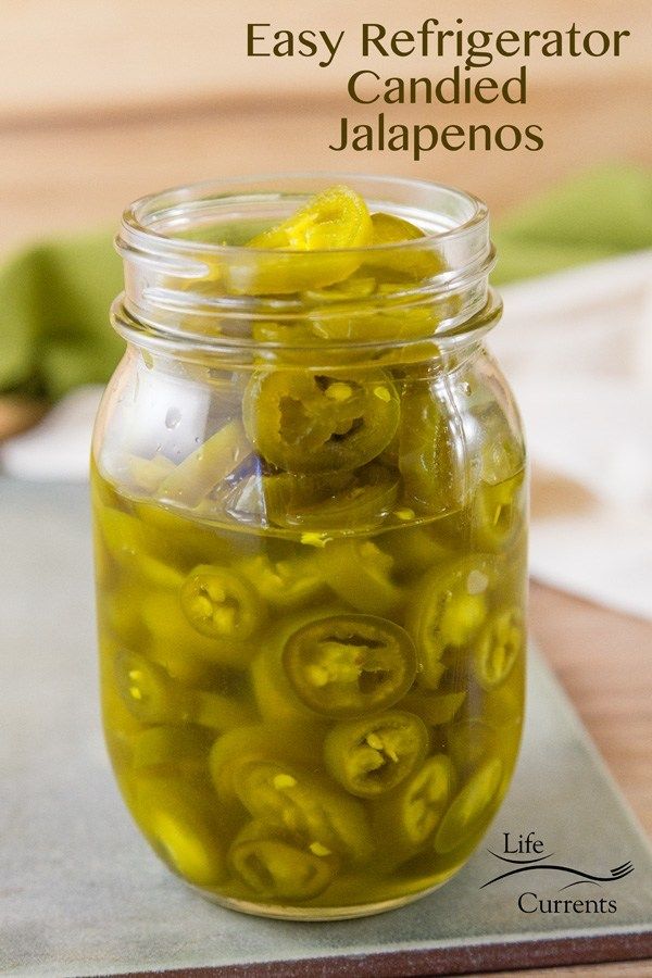 a glass jar filled with pickled jalapenos