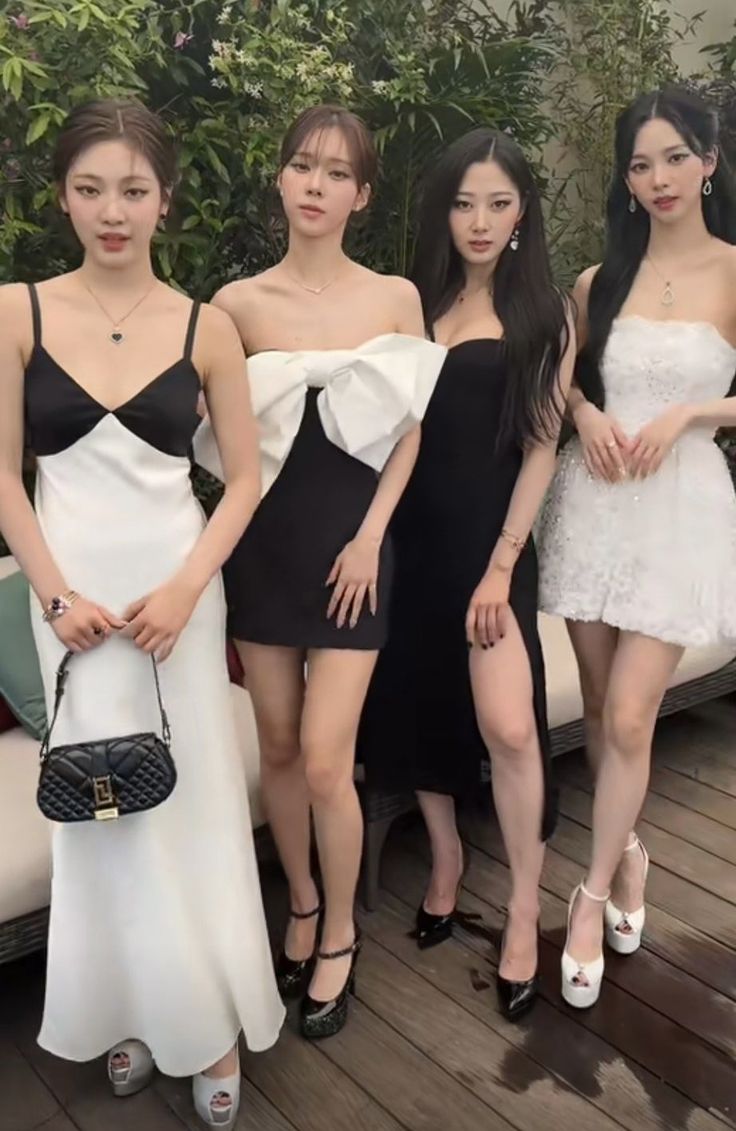 the girls are posing together in their dresses