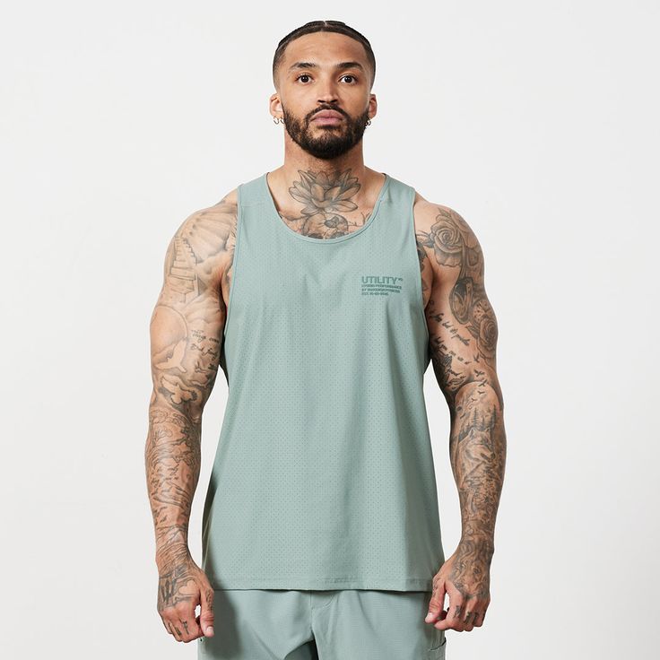 Functional Solid Color Activewear For Streetwear, Functional Activewear For Streetwear, Sporty Khaki Tops, Sporty Khaki Tops For Sports, Functional Green Activewear For Streetwear, Green Nylon Activewear For Streetwear, Green Moisture-wicking Activewear For Streetwear, Functional 4-way Stretch Activewear For Streetwear, Functional Gym Tank Top With Built-in Padding