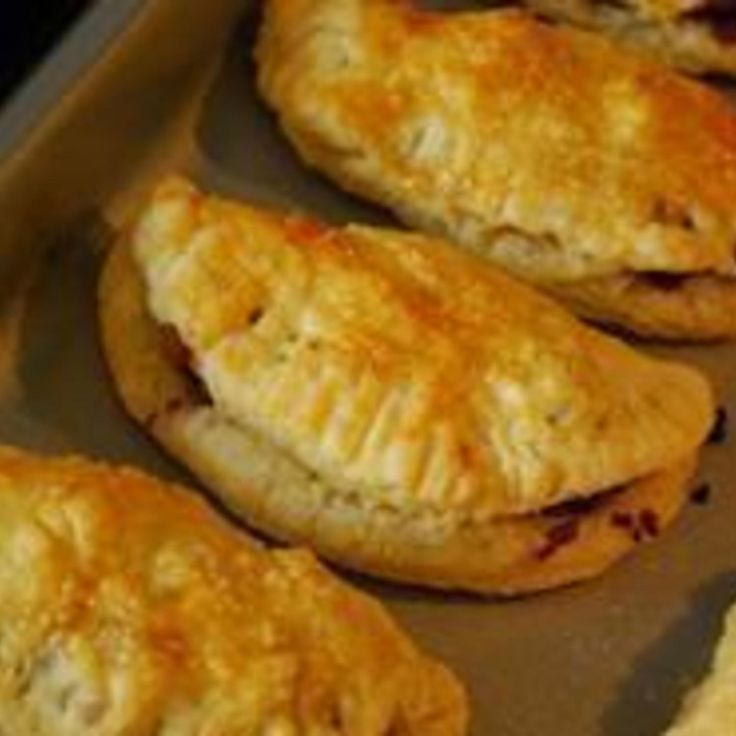 several pastries sitting on top of a baking pan