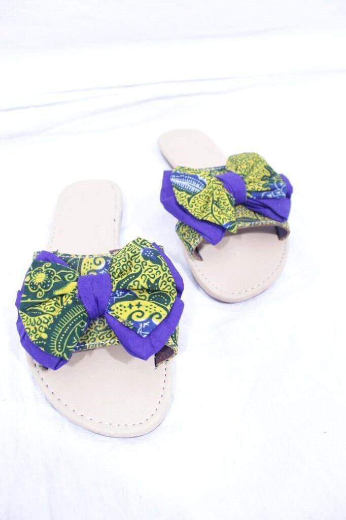 "African materials  are known for bold, unique and friendly colours. These sandals are hand  made. They are made from Ankara(cotton). They are neatly, quality and stylish made.These are perfect as a gift. Shoe Size:UK 5  Main Colour:Yellow Brand:Unbranded  Upper Material:Cotton Style:Flip Flops Heel Height:Flat (less than 0.5\") EU Shoe Size:38 Occasion:Casual" Summer Textile Sandals For Vacation, Adjustable Textile Sandals For Vacation, Adjustable Fabric Sandals For Summer, Adjustable Textile Beach Sandals, Fabric Sandals For Vacation, Flat Fabric Sandals For Summer, Trendy Fabric Beach Sandals, Flat Fabric Sandals For Vacation, Trendy Fabric Sandals For Beach