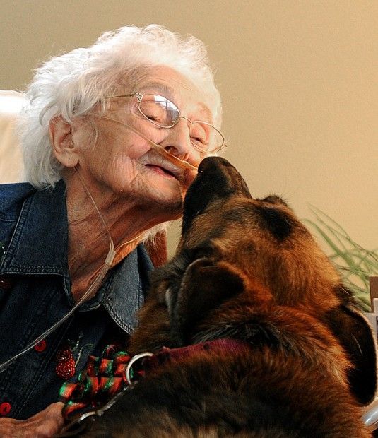 an old woman is kissing her dog's nose with the caption, god understands the commandments of each true christian