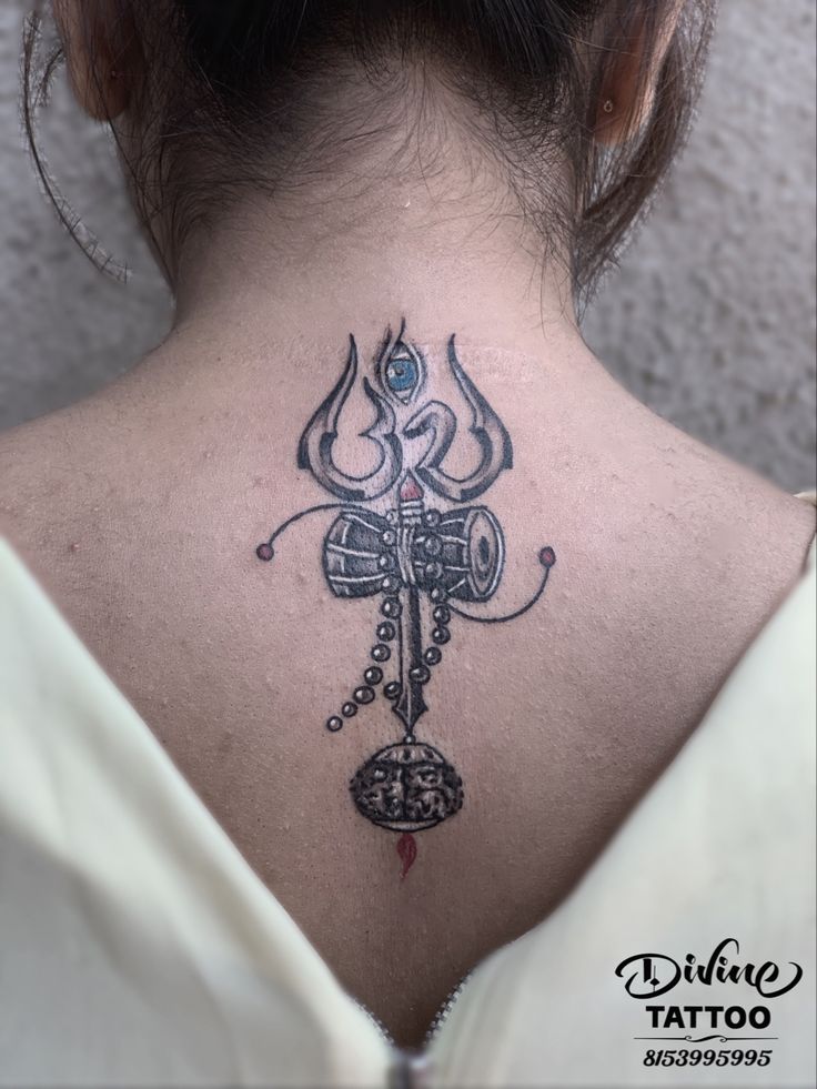 a woman with a tattoo on her back neck