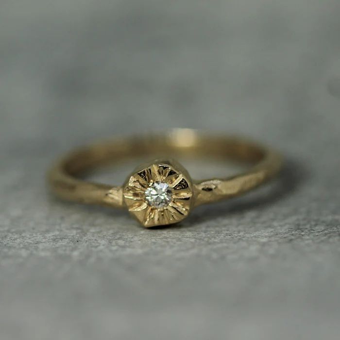 This item is made to order, please allow 2-3 weeks for production and delivery. The juxtaposition of the perfectly sparkly diamond and the rustic hand-carved feel of the solid gold sunshine setting makes this design feel extra special. The little sun diamond ring is lovely stacked or on its own, as a unique engagement ring or a just-for-fun ring! It pairs perfectly with the little sunrise ring.  2mm diamond  top of the ring is approx 5mm x 5mm  1.7mm wide hand-carved band solid 14k gold Unique Simple Engagement Rings, Sunrise Ring, Simple Unique Engagement Rings, Wax Jewelry, Sun Ring, Contemporary Fine Jewelry, Handmade Gold Ring, Push Presents, Diamond Top