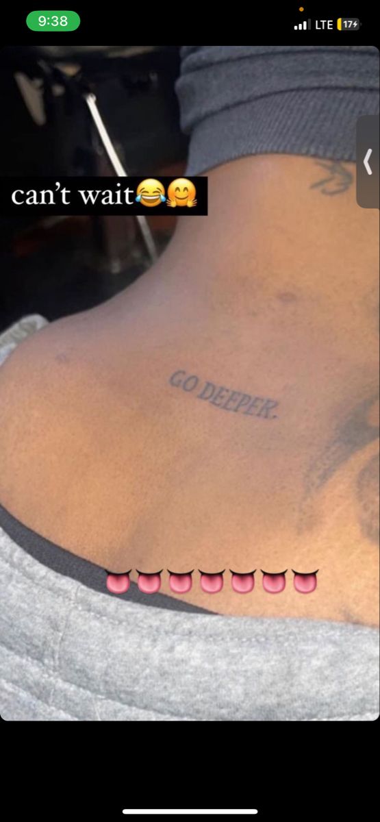 the back of a person's neck with tattoos on it and an emoticive message that reads, i can't wait