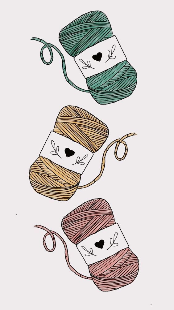 three balls of yarn with faces drawn on them and one ball of yarn in the air