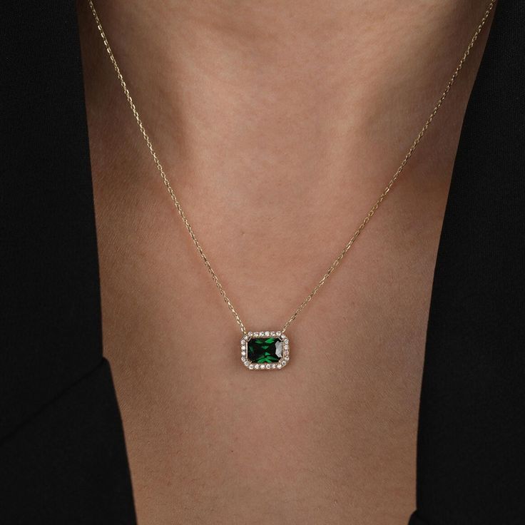 This 14K Gold Green Emerald Halo Necklace with its delicate Cz Green Emerald Halo Pendant exudes vintage charm, making it a timeless piece. An exquisite choice for an Anniversary and Christmas Gift, it adds a touch of elegance to any ensemble. A thoughtful and beautiful adornment for her special occasions. Pendant Width: 0.37 inches / 9.40 mm Pendant Height: 0.30 inches / 7.62 mm Product Features: * Made to Order  * Gold KT: 14K Solid Gold (not filled, not gold vermeil, not plated) * Gold Color: Gold Emerald Necklace With Square Pendant, Luxury Gold Emerald Necklace With Square Pendant, Gold Emerald Square Pendant Necklace, Fine Jewelry Emerald Necklace With Square Yellow Gold Pendant, Green Gold-plated Emerald Pendant Necklace, Green Gemstone Necklace, Halo Necklace, Halo Pendant, Solid Gold Chains