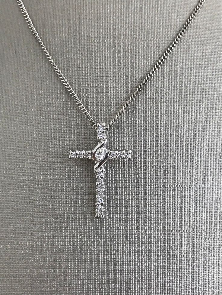 14 Karat White Gold Medium Size Cross with Diamonds and Chain For Her 18 inch chain length 2.8 grams Cheap White Cross Jewelry, Luxury White Cross Necklace Elegant Style, Luxury Classic Diamond White Cross Necklace, Luxury Brilliant Cut Diamond White Cross Necklace, Elegant Cross Chain Necklace With Adjustable Chain, Formal Clavicle Chain Necklace With Cross Pendant, Elegant Cross Necklace With Chain, Formal Cross Clavicle Chain Necklace, Formal Clavicle Chain Cross Necklace