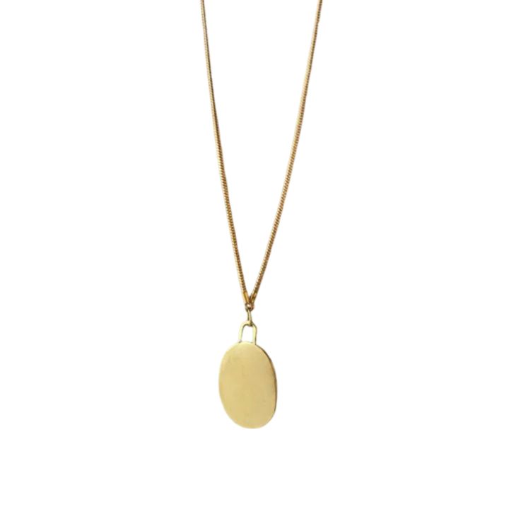 SIMPLE, TIMELESS WHAT IT IS: An organic shaped pendant necklace WHY IT’S SPECIAL: A necklace named 'pebble' in Arabic—we love this ode to the structured and natural world and it's reminder to welcome challenges and remain strong Make it extra special by engraving this pendant with up to 5 letters! Spell it out on the front or the reverse—it's the perfect personalization Handmade in St. Louis by emerging black designer Shayba Muhammad GOOD TO KNOW: Length: 17 3/8" in Gold plated brass Engraving 3 Everyday Amulet Round Pendant Charm Necklace, Amulet Style Round Pendant Necklace For Everyday, Everyday Amulet Necklace With Round Pendant, Everyday Medallion Pendant Necklace With Adjustable Chain, Oval Pendant Chain Necklace For Gifts, Oval Pendant Chain Necklace Perfect For Gifts, Chain Necklace With Large Oval Pendant For Gift, Minimalist Chain Necklace With Large Pendant, Minimalist Chain Necklace With Large Pendant As Gift