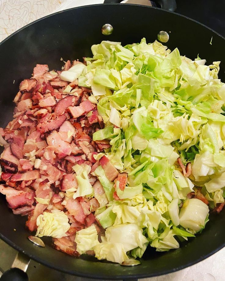 chopped lettuce and bacon in a skillet