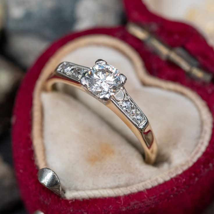 an engagement ring in a heart shaped box