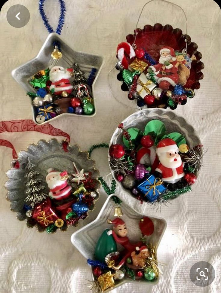 three ornaments are hanging on a table