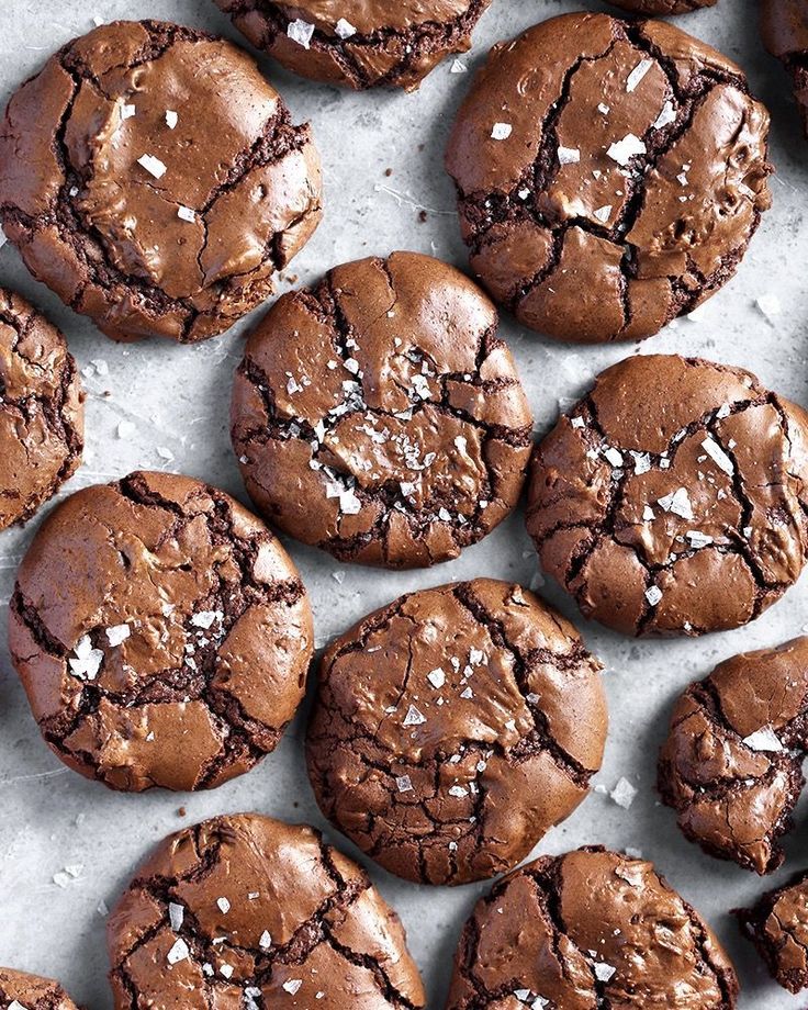 chocolate cookies with sea salt and red flower on table top, ready to be eaten