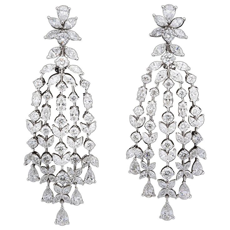 A beautiful pair of grand earrings. 15.84 carats of white round, pear, and marquise cut diamonds set in 18k white gold. A grand design that mimics those found on the red carpet today -- perfect for your next black tie affair! Approximately 2.55 inches from the highest to lowest point, just under an inch wide at its widest point. Made in New York Grand Chandelier, Modern Diamond Jewelry, Real Diamond Earrings, Pearl Chandelier Earrings, Dancing Diamond, Diamond Chandelier Earrings, Diamond Chandelier, Rose Gold Hoop Earrings, Silver Jewelry Diy