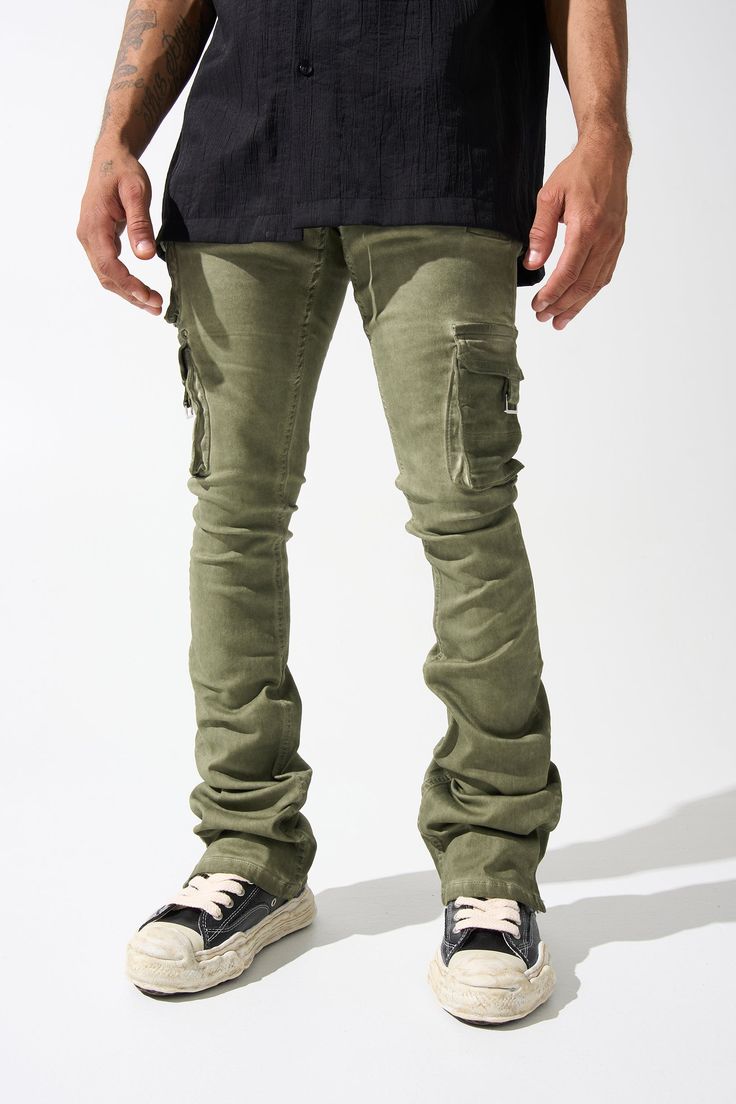 SERENEDE® "OIL" cargo stacked jeans feature our signature stretch material for a comfortable feel. Olive wash* with a slight tint of green. SERENEDE® signature skinny fit construction with a stacked ankle. This unique style features multiple cargo pockets. Designed to be individually unique. DETAILED FEATURES: OLIVE wash [ slight tint of green ] Cargo pockets Stacked finish Fading throughout Signature "leather" waistband label SERENEDE® branded hardware Five-pocket styling Zipper fly 5.5" W Ankl Cargo Outfit Men, Stacked Jeans, Cargo Outfit, Jeans Outfit Men, Green Cargo, Jean Outfits, Light In The Dark, Unique Style, Slim Fit