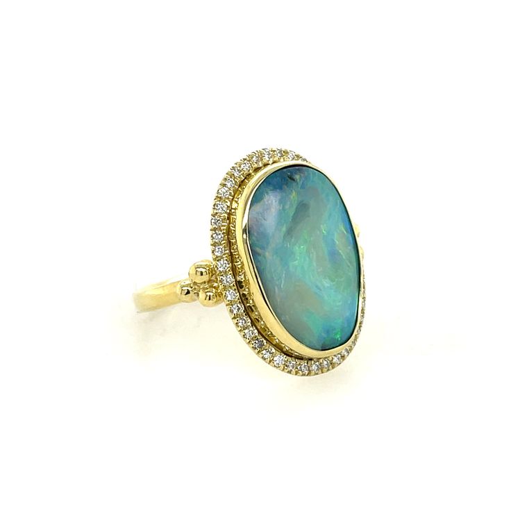 Mazza Opal & Diamond Ring In 18K Yellow Gold. The Ring Features A 8.10Ct Opal With A Halo Of 0.21Ctw Of Round Diamonds. Ring Size 7. Luxury Yellow Gold Opal Ring, Luxury 14k Gold Opal Ring, Luxury Yellow Gold Opal Ring With Brilliant Cut, Luxury Opal Gemstone Ring For Formal Occasions, Luxury Yellow Gold Halo Ring With Gemstone, Exquisite Oval Rings With Pave Setting, Exquisite Oval Ring With Pavé Setting, Luxury Diamond Opal Ring, Luxury Yellow Gold Opal Ring With Halo Setting