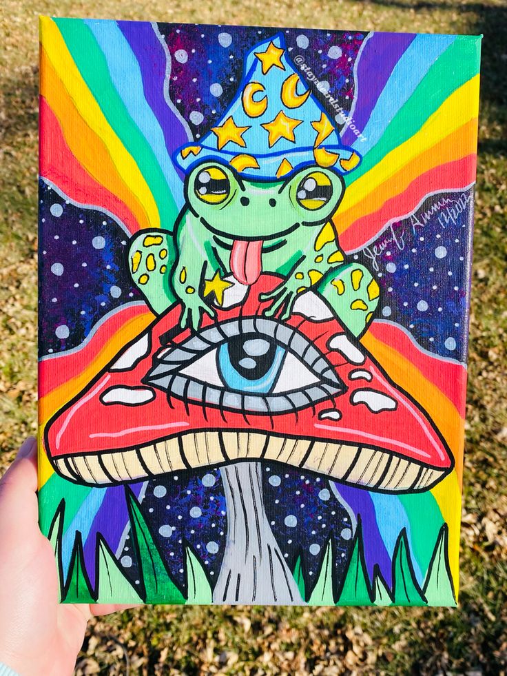 a painting of a frog with a crown on top of a mushroom in the grass