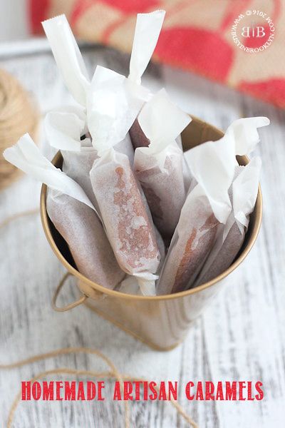 the cover of homemade artisan caramels is displayed in a small cup with twine