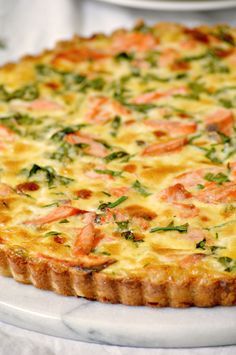 a quiche is shown on a white plate