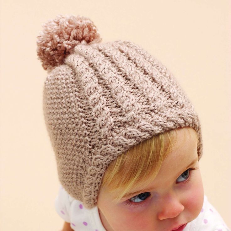 Free Intermediate Knit Hats Pattern For BabyA delicate hat with cable trim makes a darling gift for any tiny tot. Bernat Softee Baby is OEKO-TEX Standard 100 certified, so it's always safe to use. Select your color and let's get you on your way to completing a warm hat that looks priceless. Flat Knitting Patterns, Beany Hat, Baby Hat Knitting Pattern, Hat Knitting Pattern, Baby Knitting Patterns Free, Hat Knitting, Baby Hats Knitting, Knit Hats, Knitting Supplies