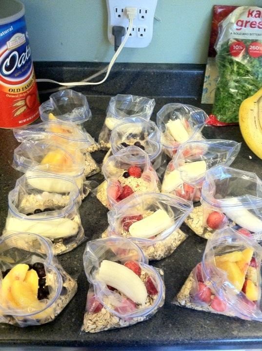 several plastic containers filled with food on top of a counter