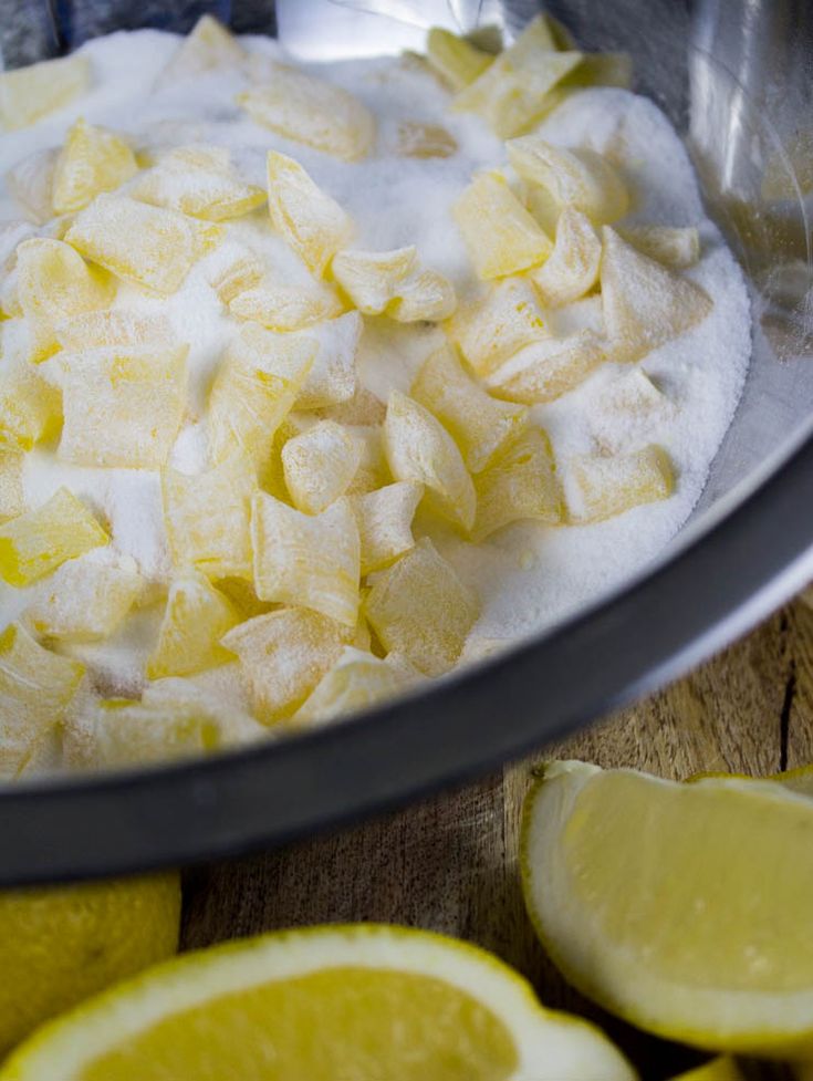 lemons and sugar are mixed together in a bowl