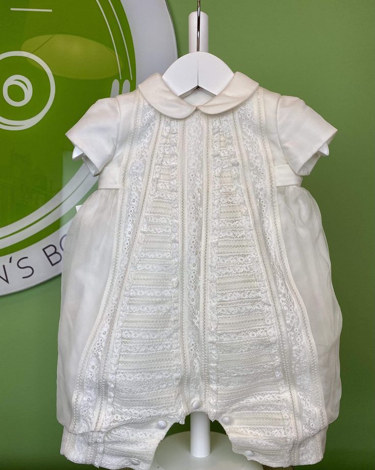 An elegant one-piece bubble outfit for baby, unisex. It is made in off-white organza with laces. It has buttons on the back and bottom for closure. Ideal to wear at any special occasion. Made in Portugal Handwash or Dry Clean Final Sale, no exchanges nor returns will be available Cream Fitted Bubble Romper With Ruffles, Fitted Cream Bubble Romper With Ruffles, Cream Bubble Romper With Ruffles For Baptism, Cream Ruffled Bubble Romper For Baptism, White Ruffled Bubble Romper For Party, Spring Baptism Cream Bubble Romper, Elegant White Bubble Romper For Spring, White Fitted Bubble Romper For Baptism, White Bubble Romper For Baptism In Spring