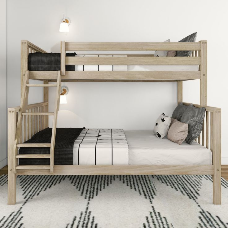 there is a bunk bed with a ladder on the bottom and a black and white rug underneath it