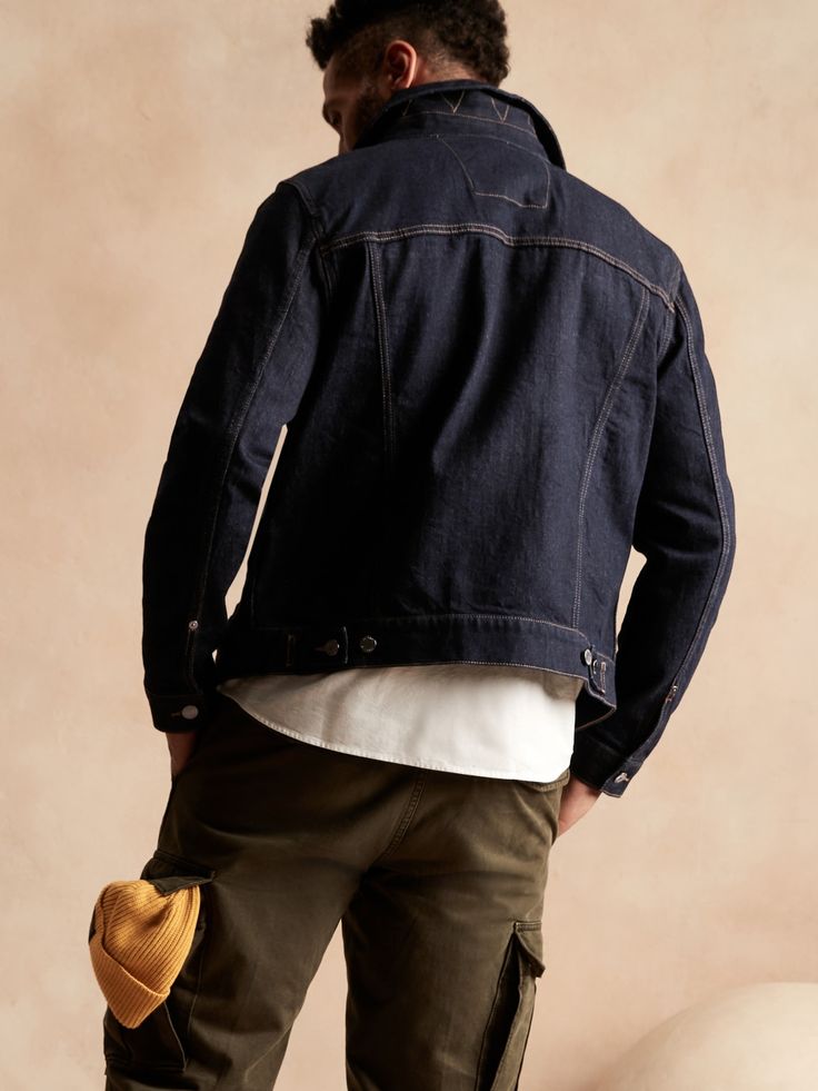 A wardrobe workhorse, this jean jacket is made in a sturdy denim with just a touch of stretch for comfort.  Point collar.  Chest pocket.  Button front closure.  Side pockets.  Unlined.  Produced in a facility that runs P. A. C. E.  – Gap Inc. 's pr Denim Trucker Jacket, Empower Women, Black Denim Jacket, Denim Jacket Men, Trucker Jacket, Chest Pocket, Black Denim, Jean Jacket, Women Empowerment