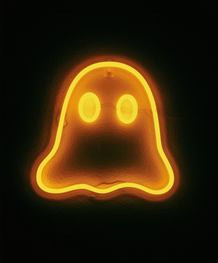 a neon sign that looks like a ghost with two eyes on it's head